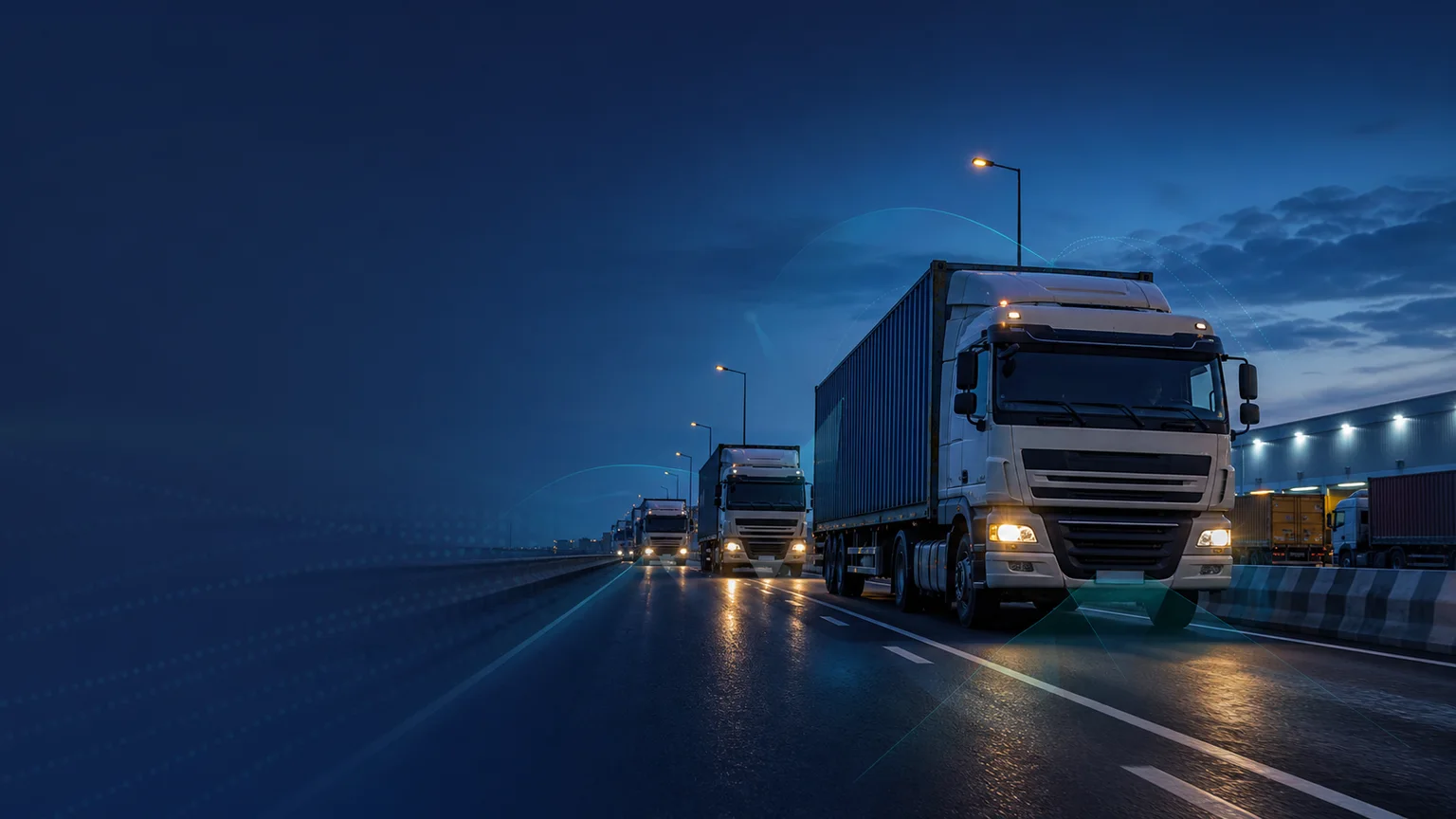 Fleet trucks on a highway at night in an illustrative commercial vehicle application scene